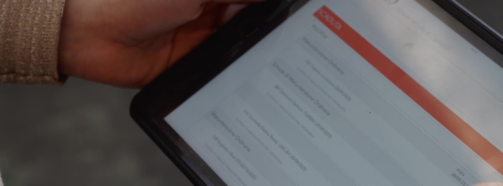 An operator checks data on a tablet